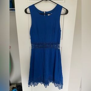 Blue sleeveless lace detail dress. Sheer lace waist
